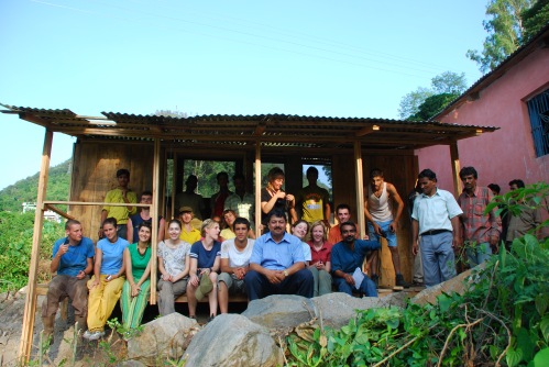 The participants outside the almost complete shelter